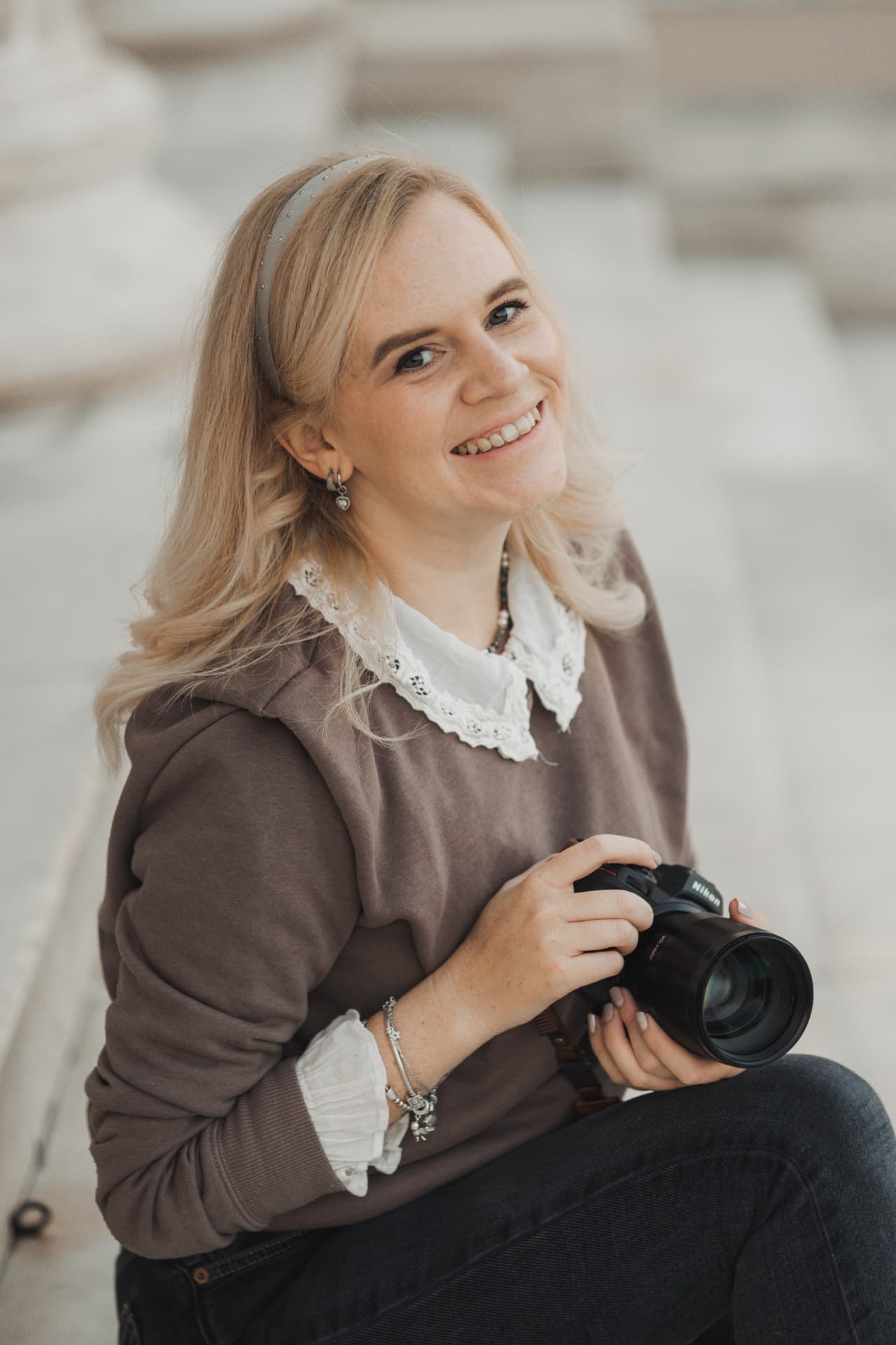Carolin, wedding photographer, holding her camera